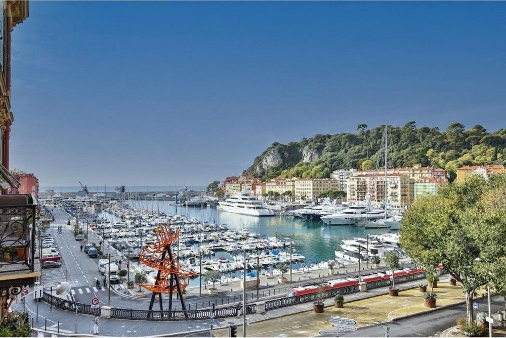The yachts of the Port of Nice with the hill of Mont Boron beyond